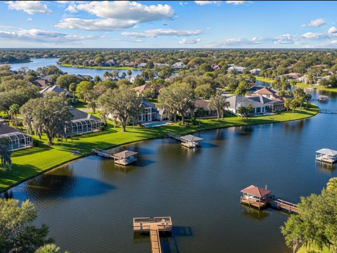 Aerial view of lakefront homes and boat docks in Windermere, Florida