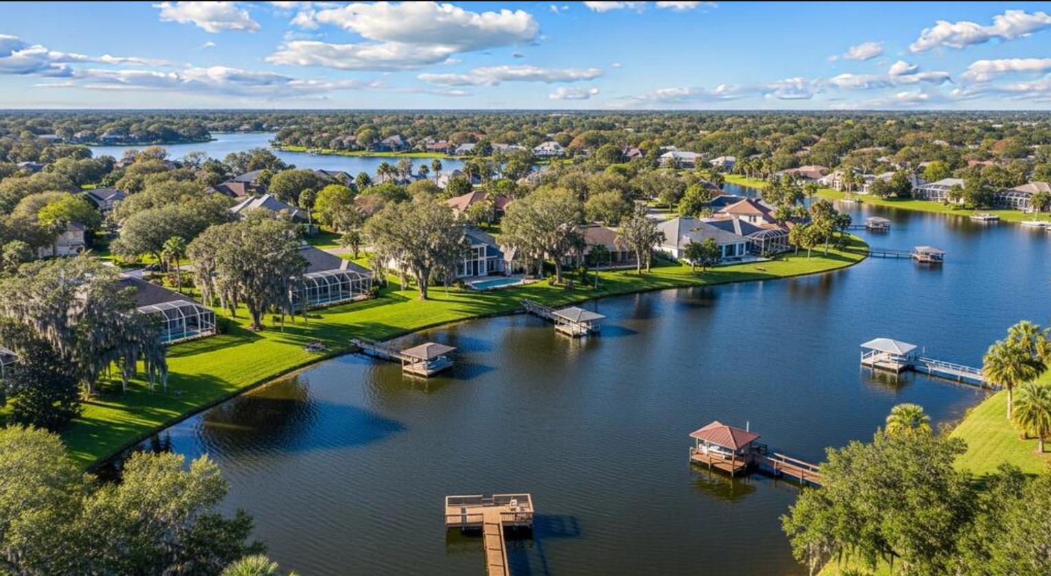 Aerial view of lakefront homes and boat docks in Windermere, Florida